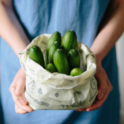 Mini cucumbers wrapped in an all natural Abeego bag.
