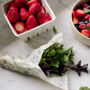 A bunch of mint partially wrapped in a medium beeswax wrap, used for a summer berry salad.