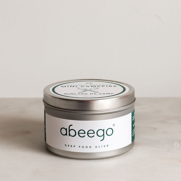 Abeego Mini Campfire in a silver tin with a white label with green text. Minimalist, clean design.