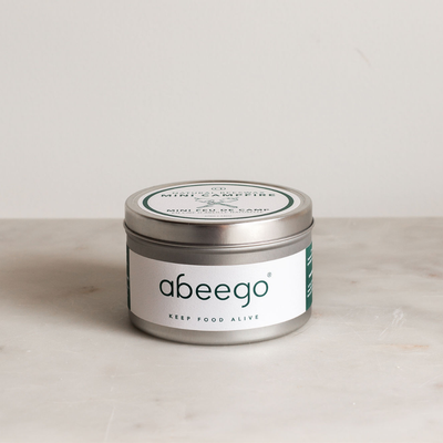 A tin of the all natural, up-cycled, and portable Abeego mini campfire.